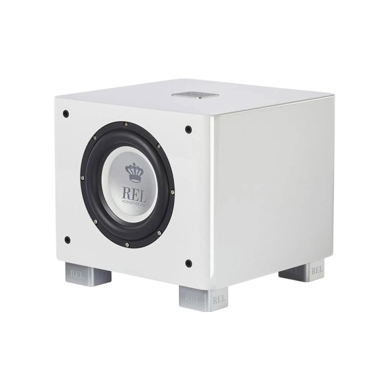 REL T/5x en blanco, vista de tres cuartos con el altavoz de cono plateado y el logotipo REL a la vista